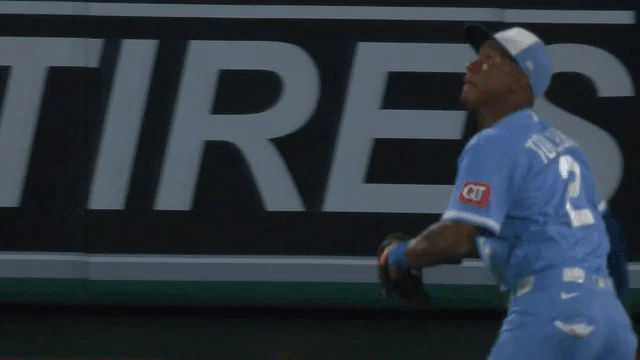 An animated gif of Royals outfielder Tyler Tolbert making a diving catch