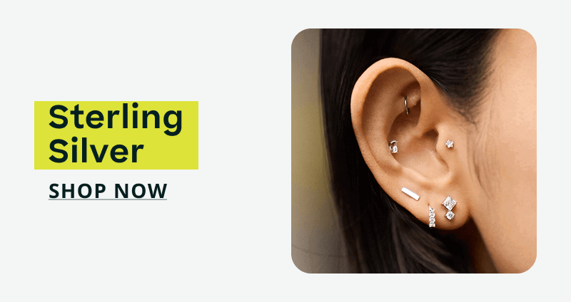 Close-up of geometric ear stack with silver-set diamond studs. Sterling silver. Click here to shop now
