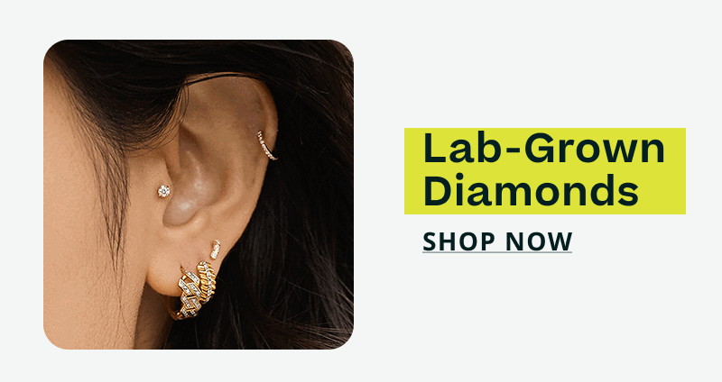 Close-up of ear stack with gold-set diamond huggies & studs. Lab-grown diamonds. Click here to shop now