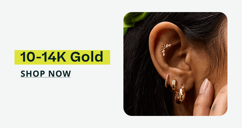 Close-up of gold ear stack with hoops, huggies & diamond climber. 10-14K gold. Click here to shop now