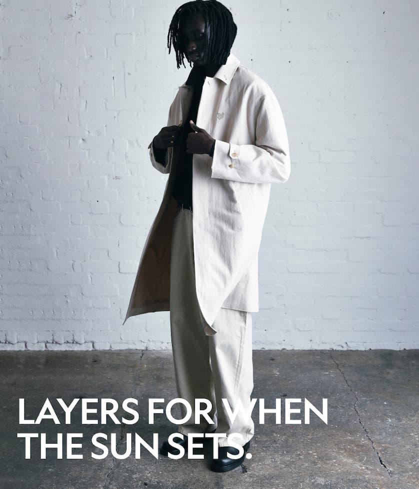Model wears lightweight overcoat