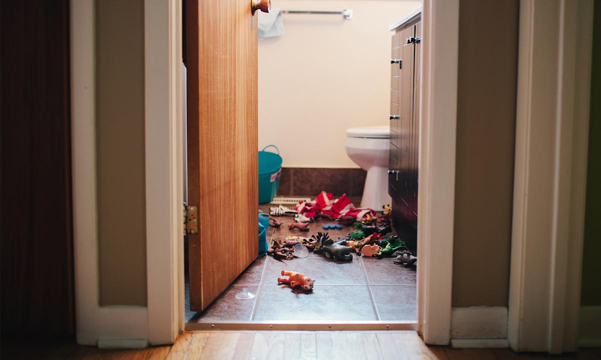 toys scattered on bathroom floor