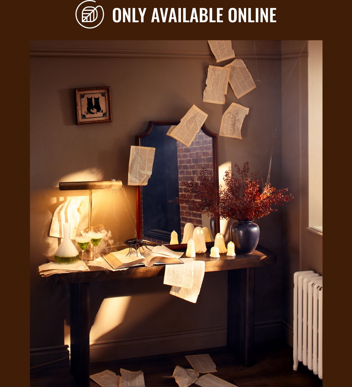 Online Only; Halloween decor with flying sheets of paper, spider, ghosts, grimoire and mirror.