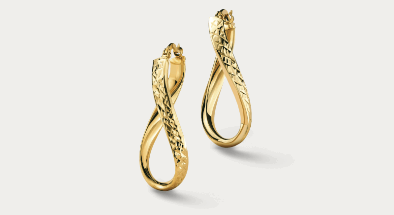 Twisted yellow gold drop earrings with textured finish.