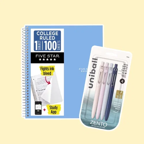blue notebook and package of uniball pens
