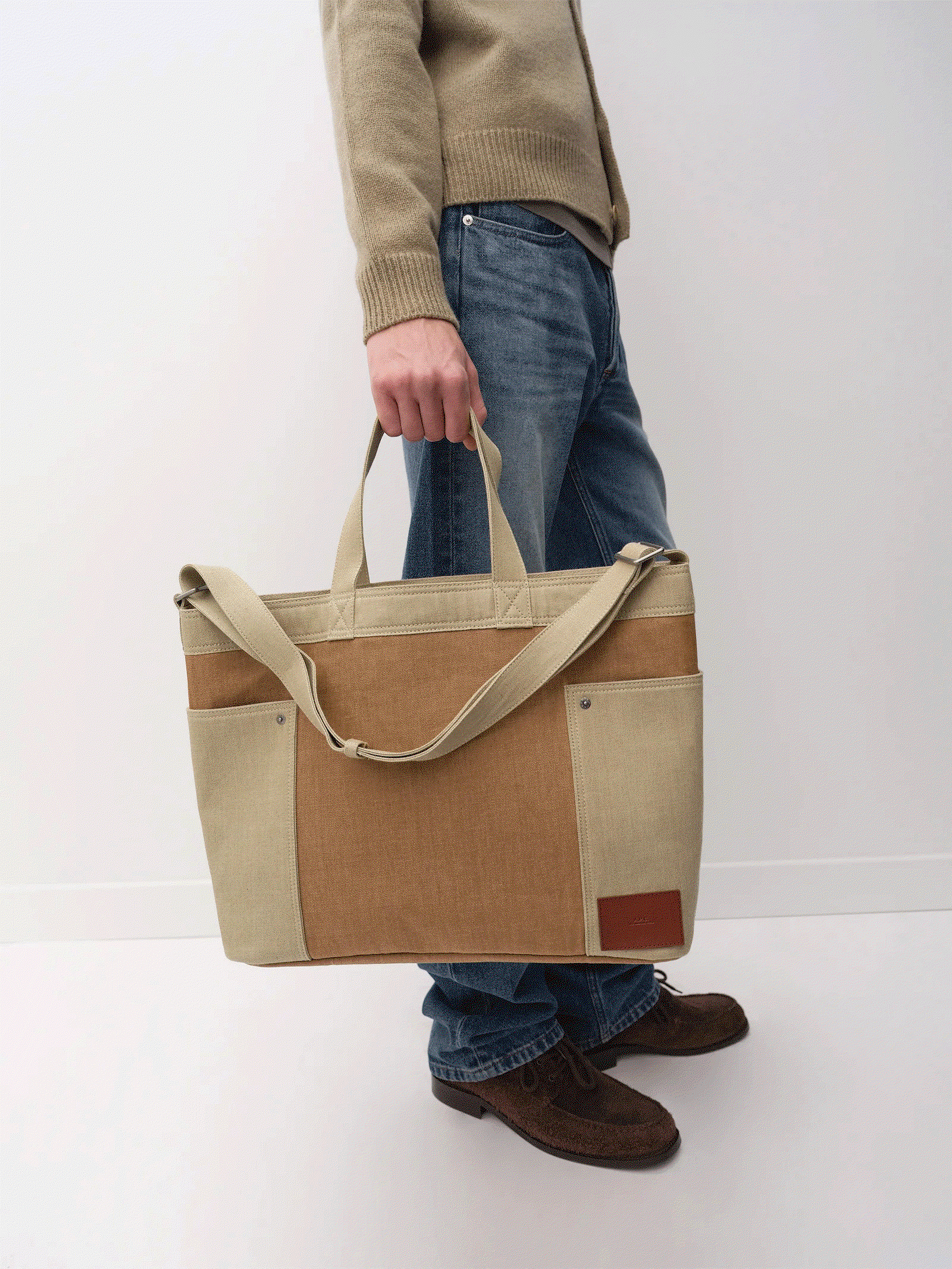A.P.C. Prefall collection bags held by model