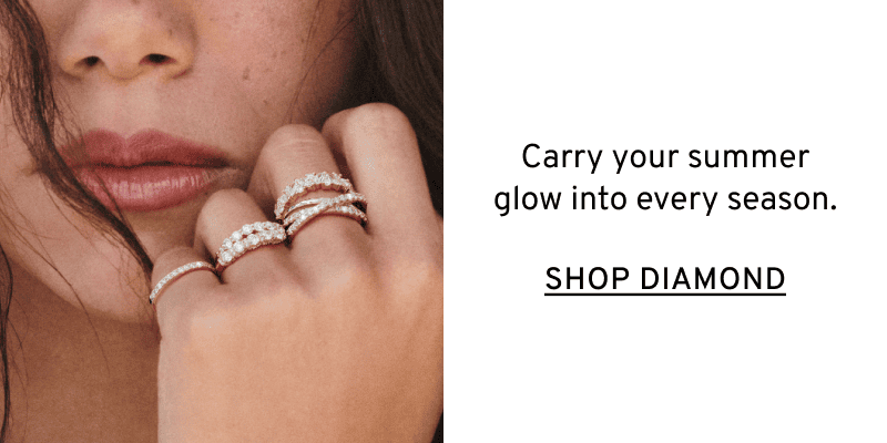 A model wearing a row of different stackable diamond rings. Glow through every season. Click to Shop Diamond Rings