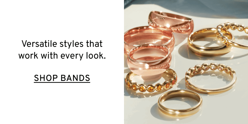 A pile of stackable rings made from different metals. Versatile styles. Click to Shop Bands
