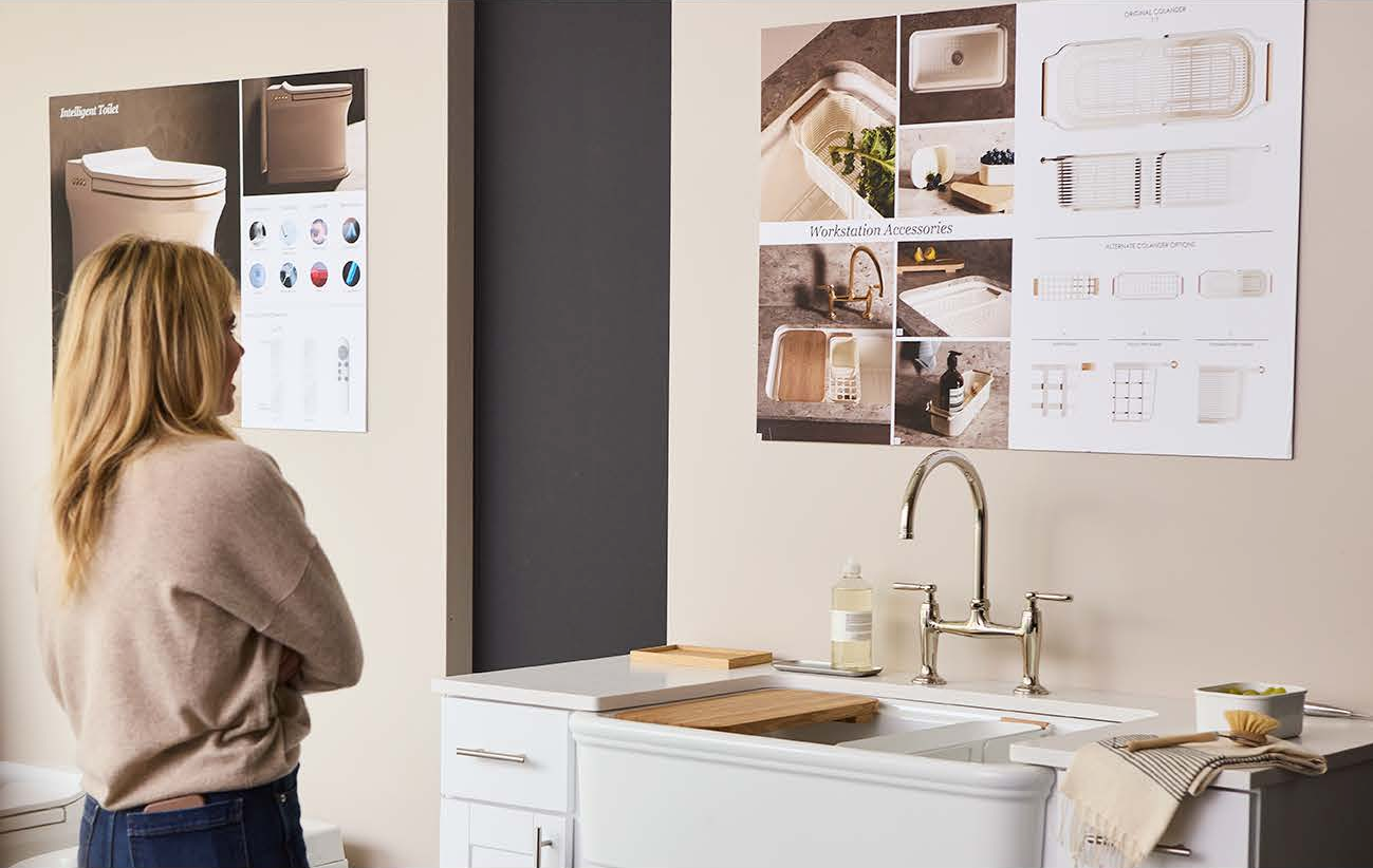 Shea looking upon ideas and concepts displayed on a wall