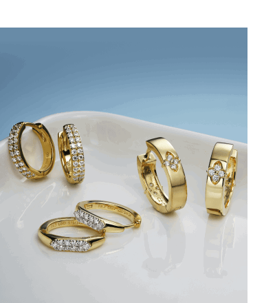 Assorted yellow gold hoops earrings and huggies with diamond accents and pavé settings