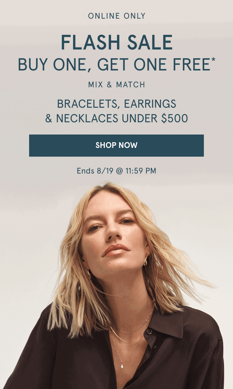 Woman wearing layered yellow gold chains and stacked earrings. Buy one, get one free. Jewelry under $500. Click shop now.