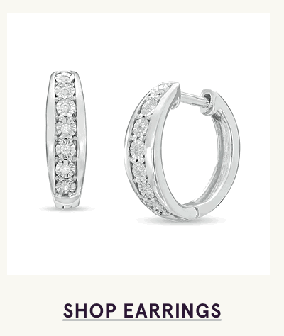 White-metal thick huggies lined down the center with row of round-cut stones. Click here to shop earrings