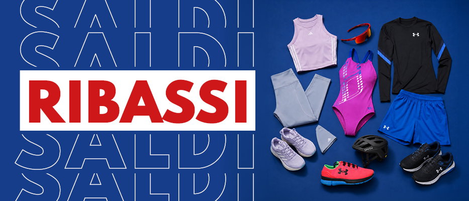 Flatlay of assorted sportswear and footwear on blue background beside bold 'RIBASSI' sale graphic