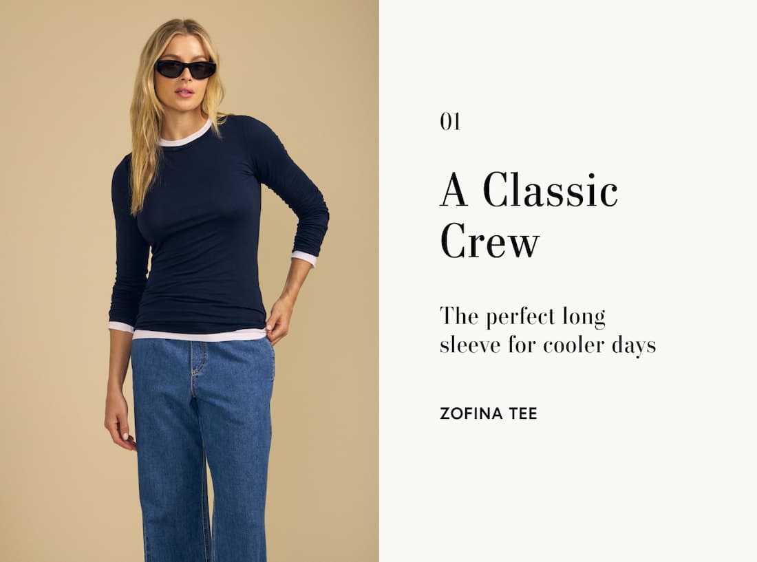 Image of model wearing Zofina in Navy. Text reads: A classic crew. The perfect long sleeve for cooler days