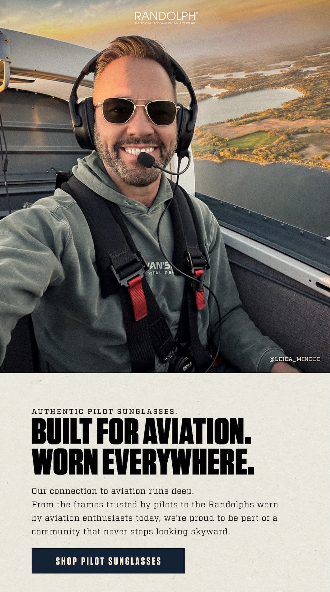 Pilot wearing Randolph Aviator sunglasses and a headset while flying above the countryside.