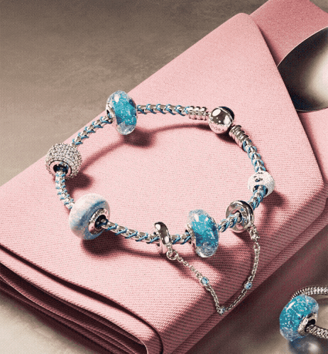 Blue ice cream in a bowl with blue Pandora charms