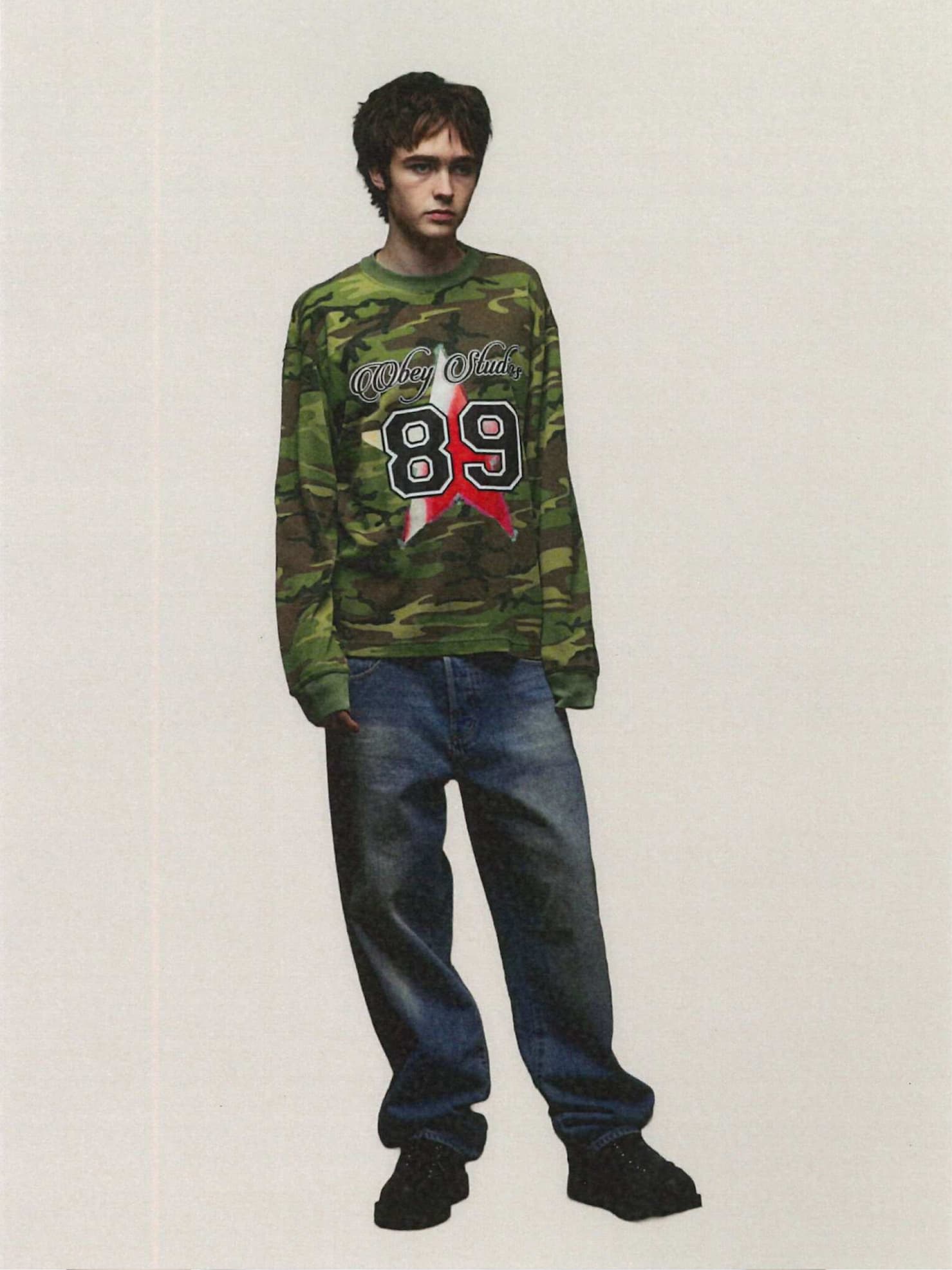 Model wearing obey long sleeve shirt with star and 89