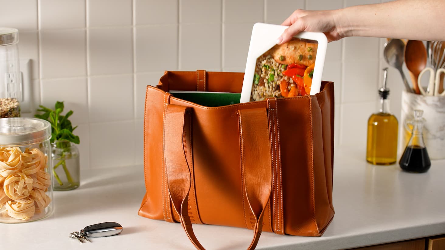 scene of food being placed into mixing bowls with a person in the scene