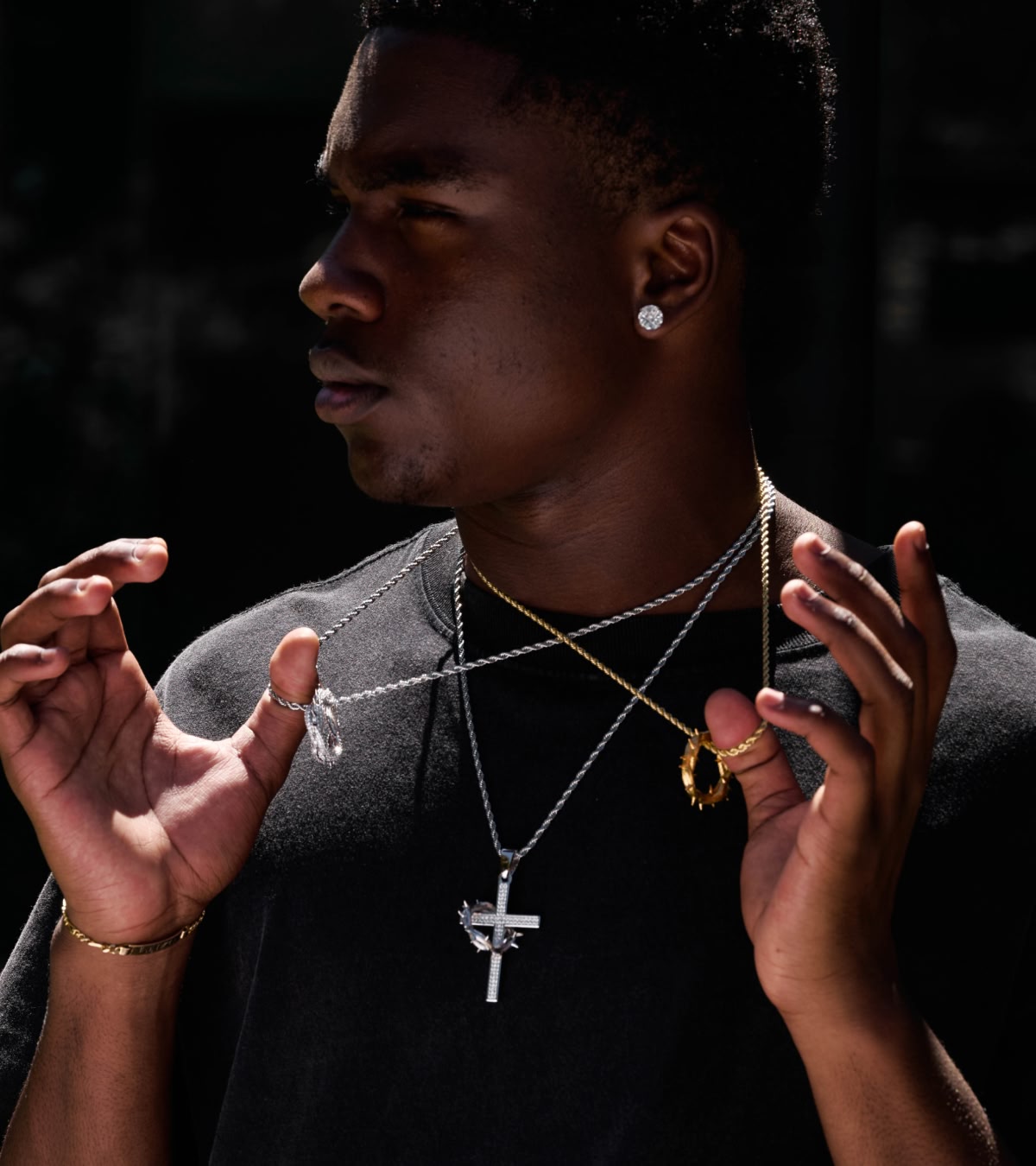 Shop jewelry, featuring new chains with religious imagery from King Midas