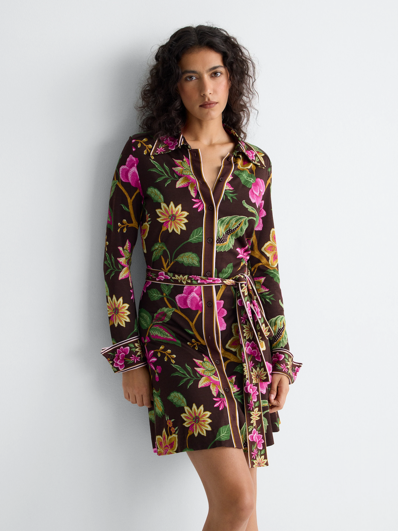 Model wearing a long-sleeve shirt dress.