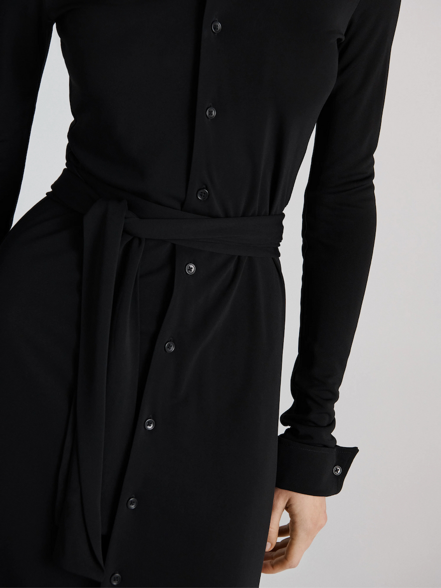 Model wearing a long-sleeve shirt dress.