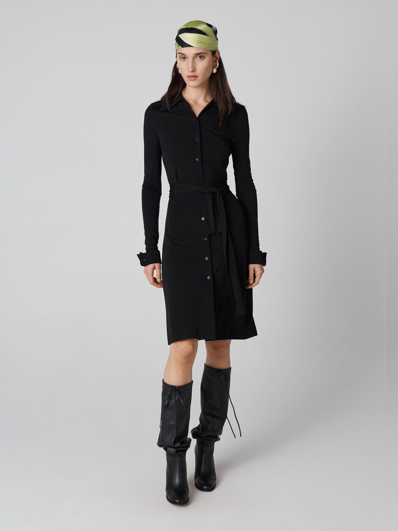 Model wearing a long-sleeve shirt dress.