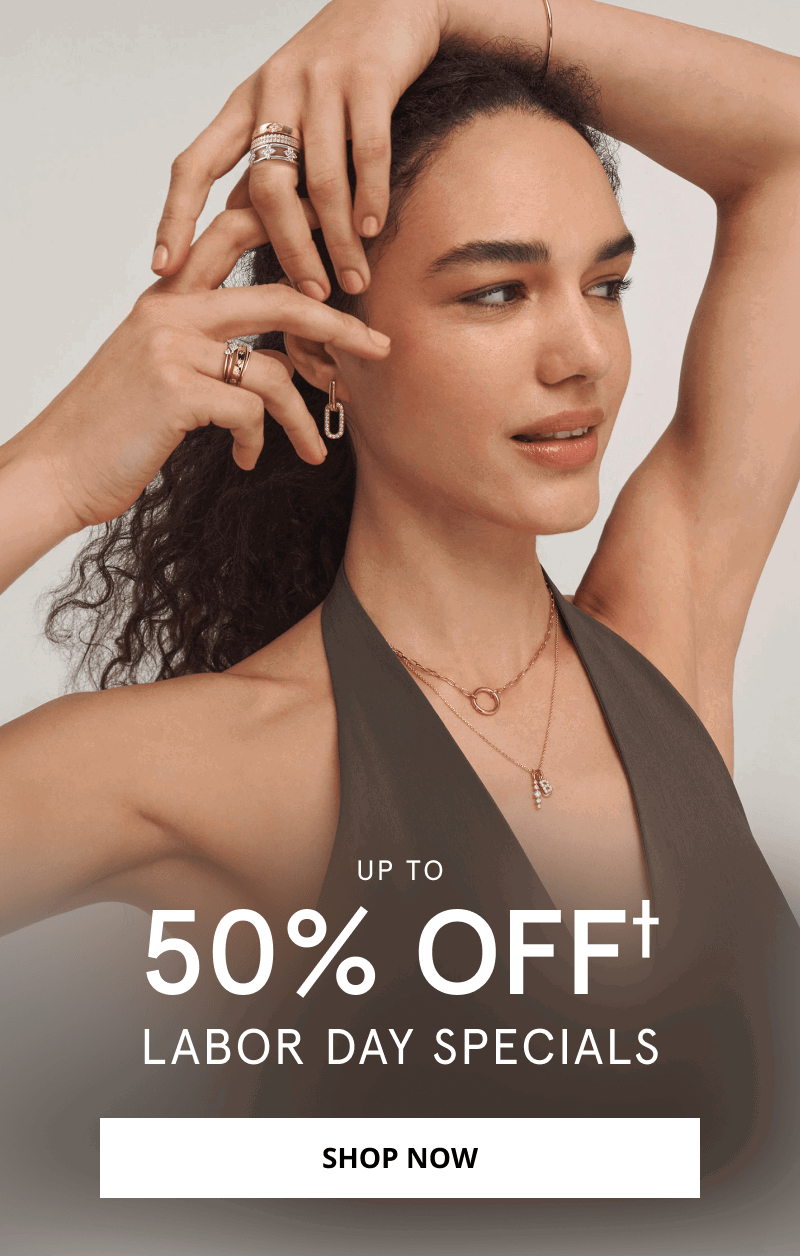 Woman wearing layered gold necklaces, earrings, diamond rings and a bracelet. Up to 50% OFF Labor Day specials. Click shop now.