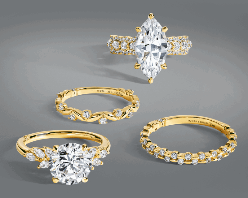 Diamond engagement rings and coordinating diamond wedding bands in yellow gold.