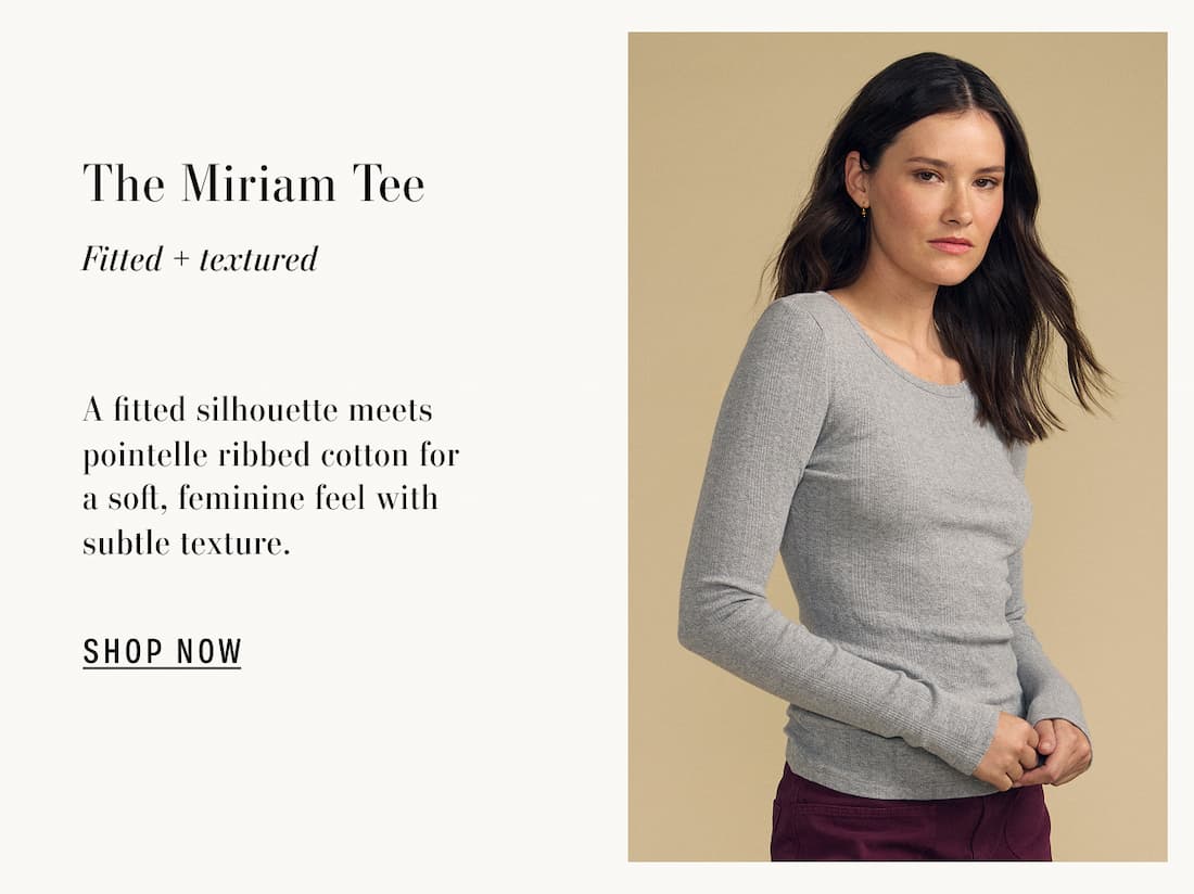 Image of model wearing Miriam in Heather Grey. Text reads: The Miriam Tee. Fitted + Textured. A fitted silhouette meets pointelle ribbed cotton for a soft, feminine feel with subtle texture.