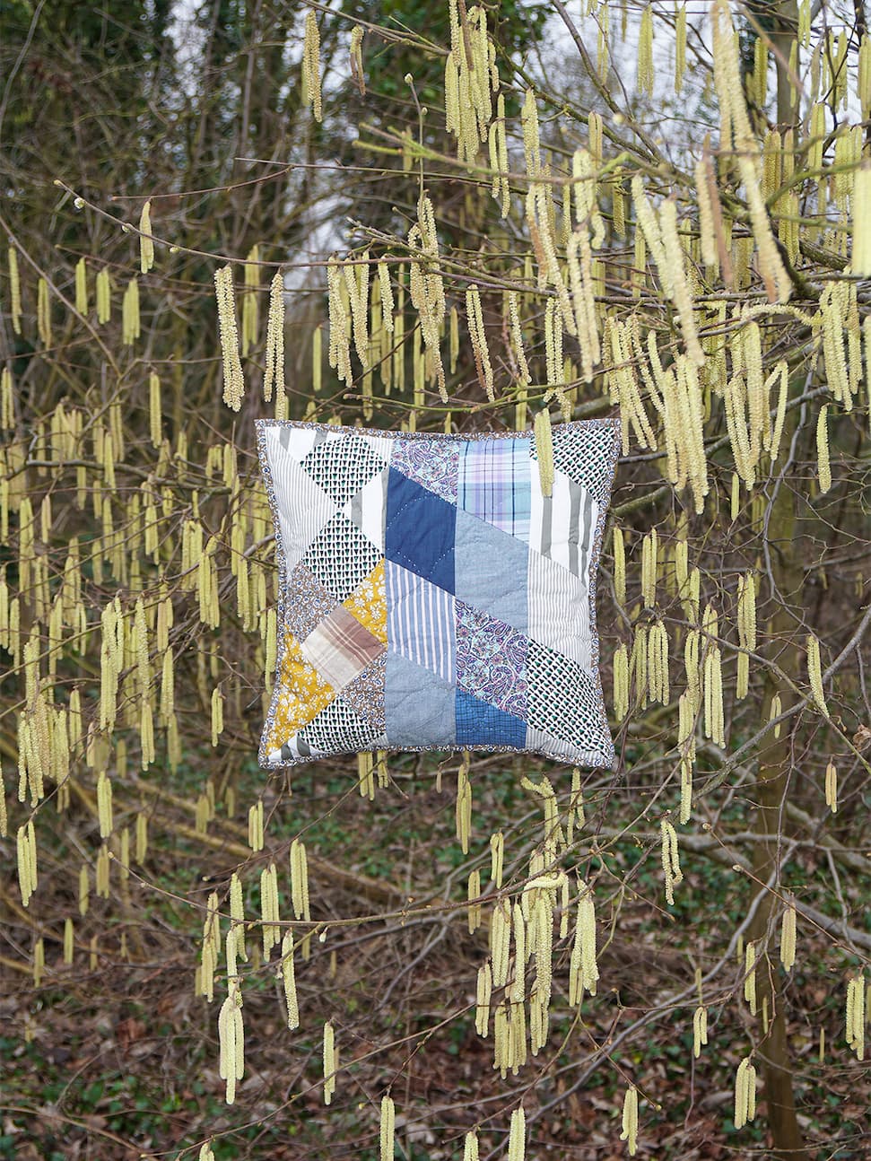 A.P.C. Quilts - pillow floating in a tree