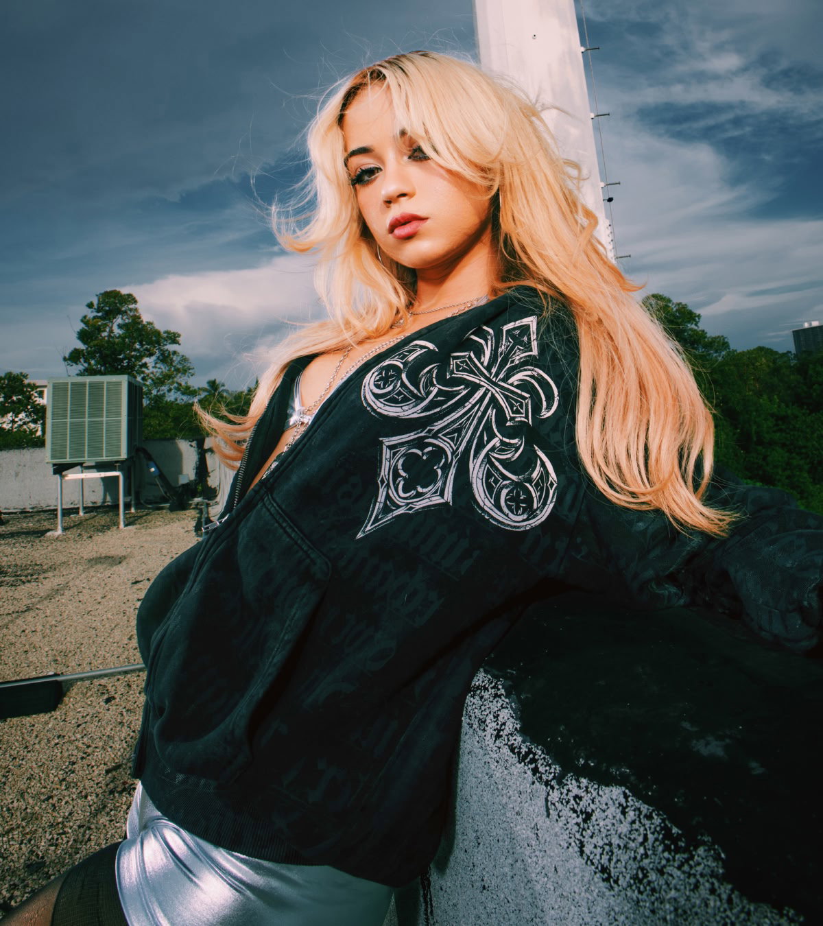 Shop Affliction x Rogue | An girl wearing one of the hoodies drooped off of one shoulder