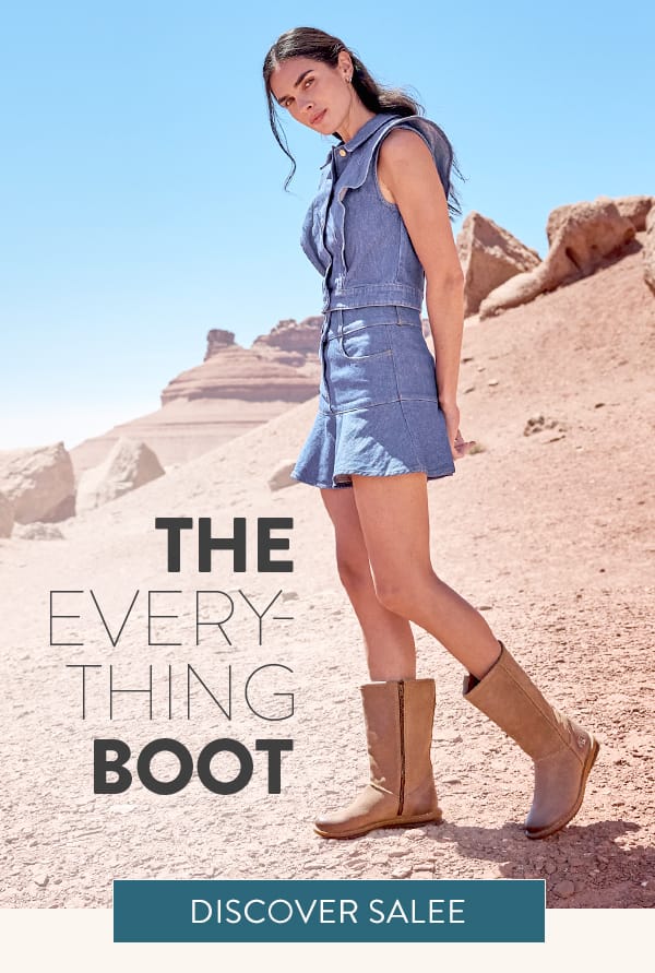 The Everything Boot. Discover Salee. A woman stands in the desert wearing the Salee mid calf side-zip boot in beige suede.
