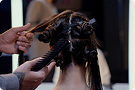 Hair is styled using Dyson hair care devices.