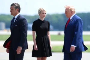 U.S. Secretary of War Pete Hegseth, executive assistant to U.S. President Donald Trump Natalie Harp and U.S. President Donald Trump attend a dignified transfer at Dover Air Force Base on July 22, 2026 in Dover, Delaware.