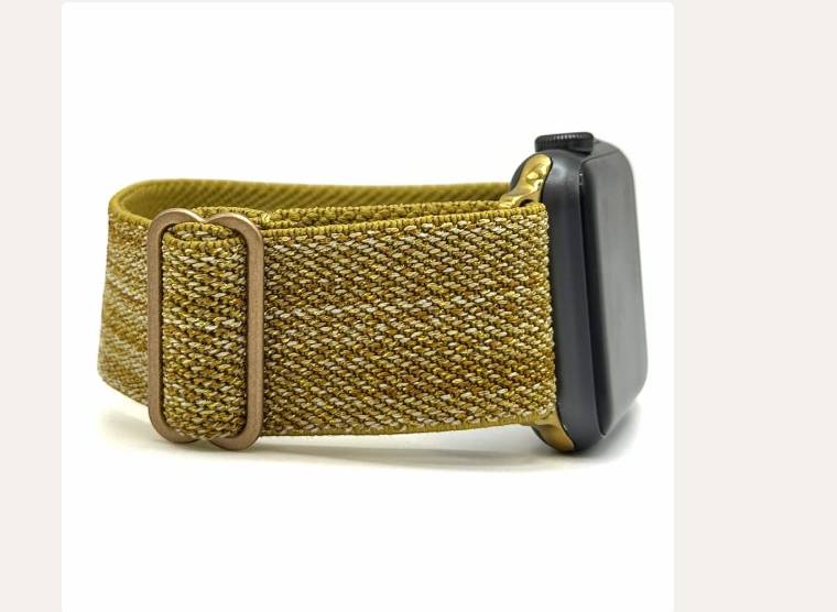 Golden Royal Apple Watch band on a black Apple Watch.