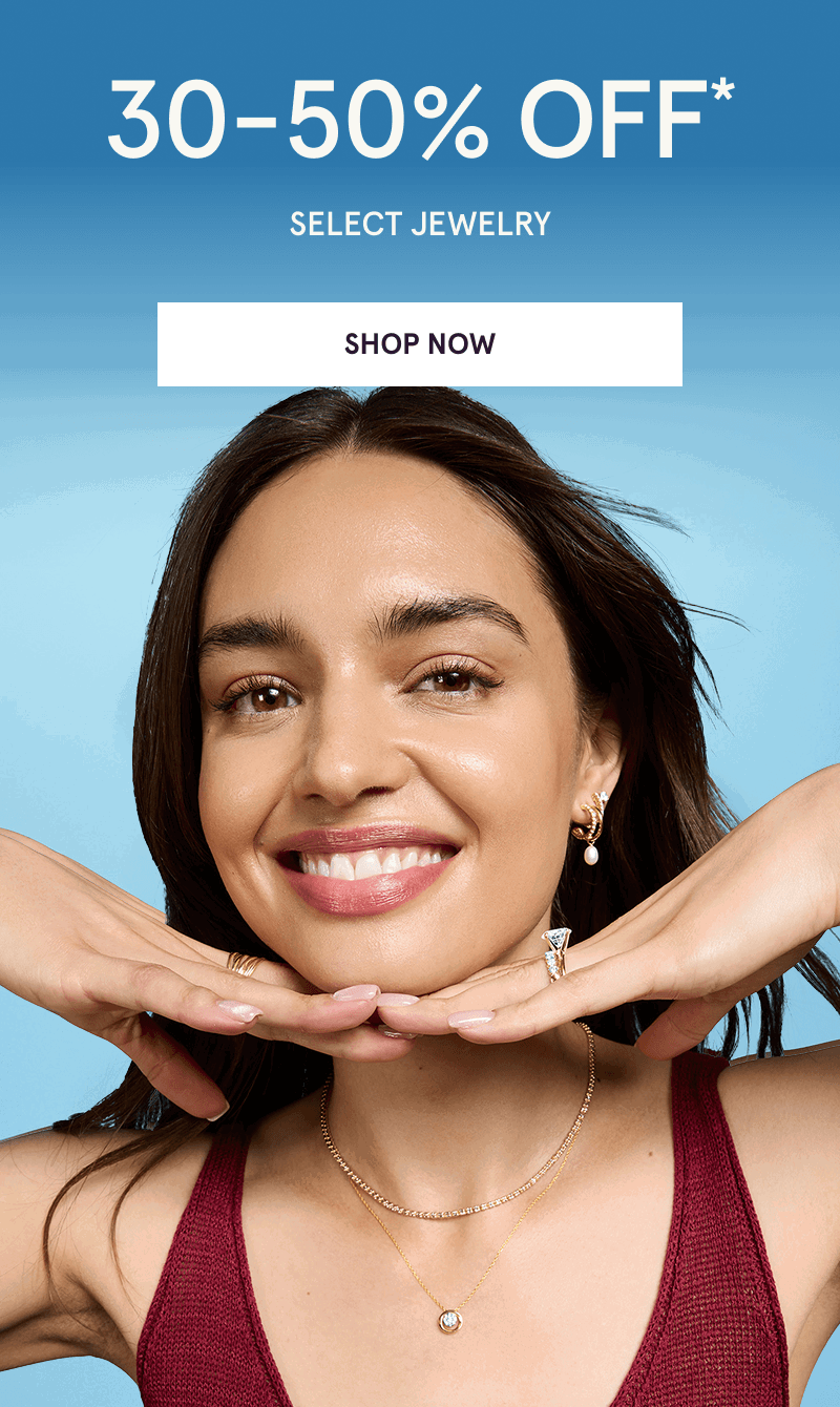 Model with diamond ring, gold ear stack, rings & layered pendant chains. 30-50% OFF Select Jewelry. Click here to shop now
