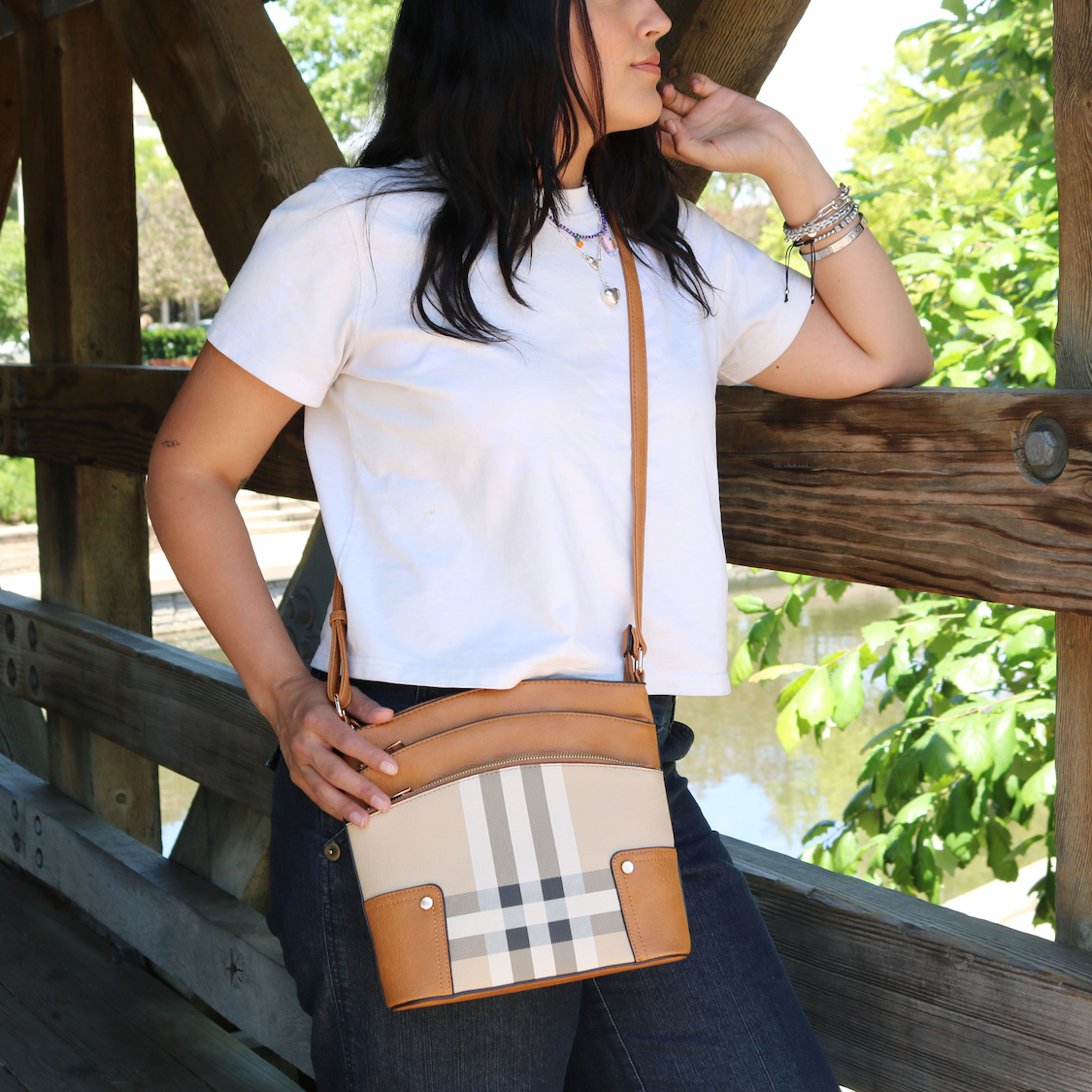 Woman wearing plaid crossbody bag