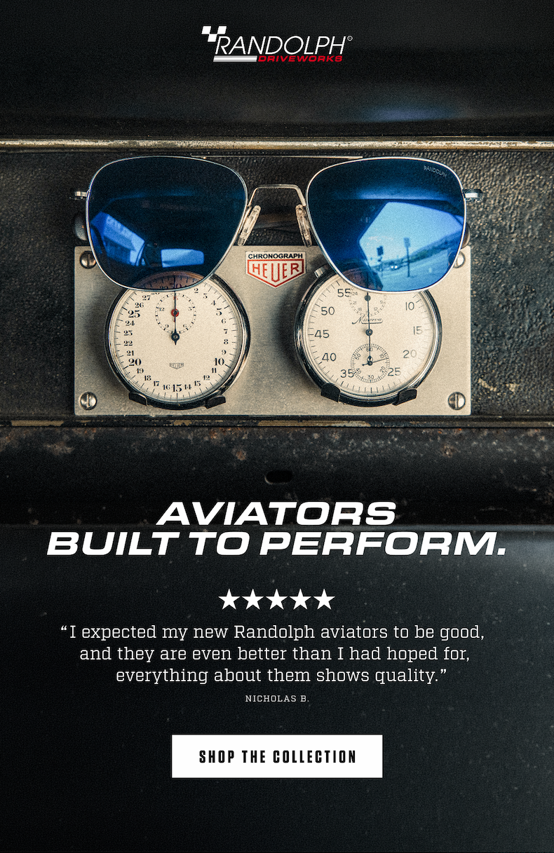 Randolph Driveworks Aviator performance sunglasses with blue lenses displayed on a vintage motorsport chronograph.
