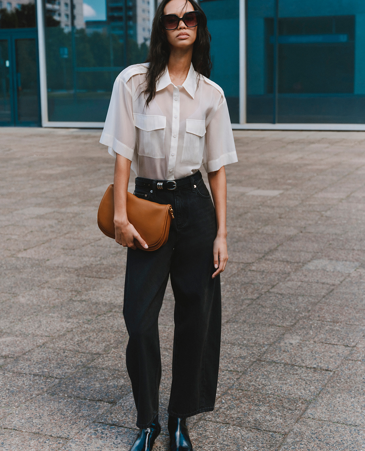Woman wearing Sheer Collared Utility Shirt & Black Mid Rise Barrel Jeans