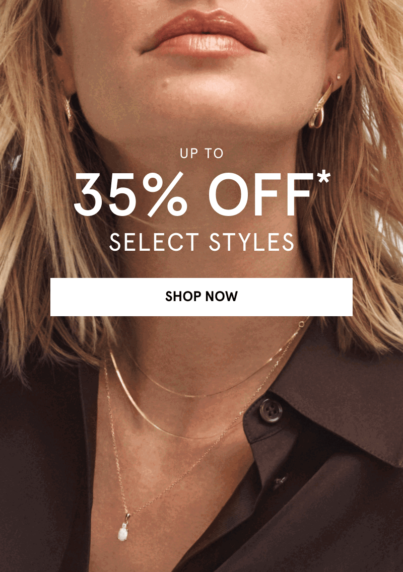 Woman wearing layered gold necklaces and gold hoop earrings. Up to 35% OFF select styles. Click shop now.