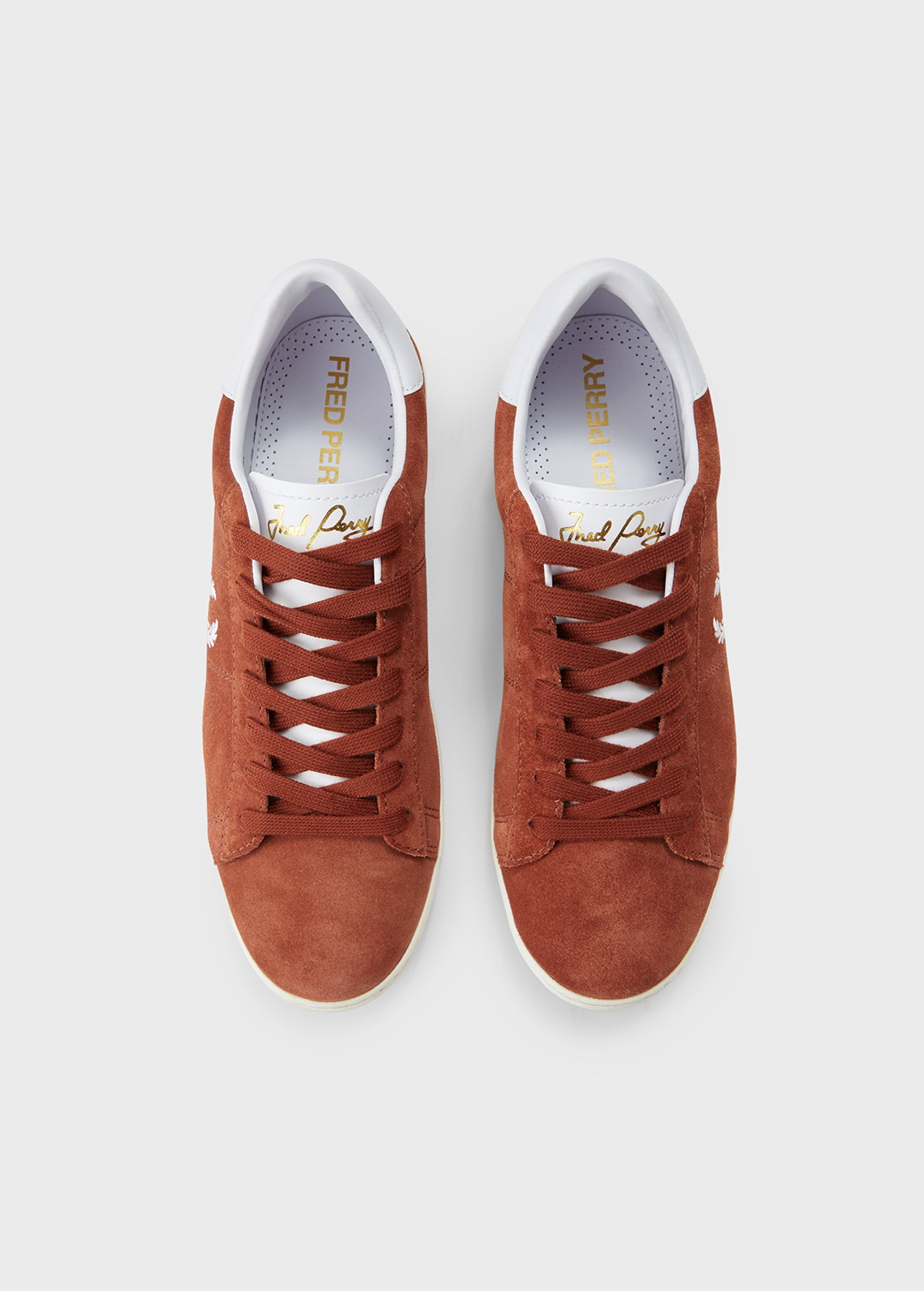 A pair of Fred Perry Suede Spencer Tennis Shoes in Brandy 