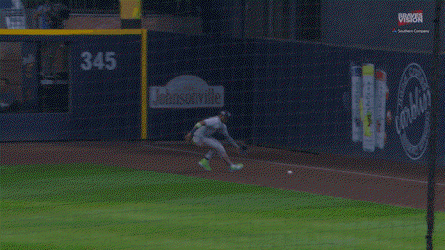 An animated gif of Ronald Acuña Jr. firing a throw from the right-field corner to second base on the fly