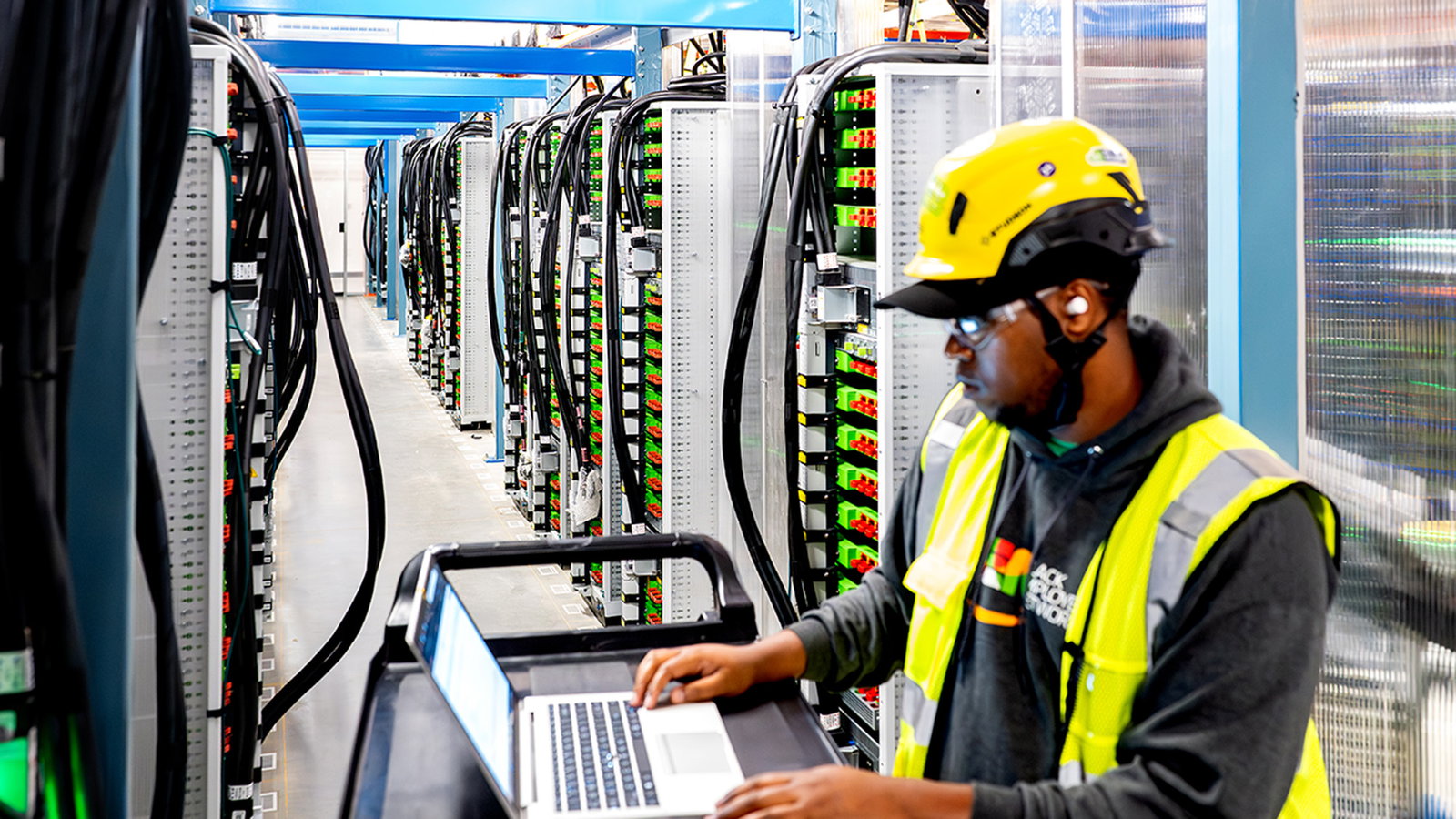 An Amazon employee working in a data center. 