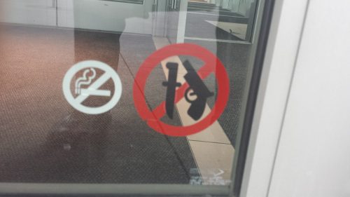 No guns sign posted on a business entrance