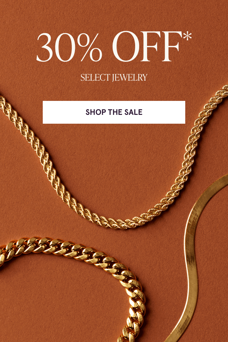 30% OFF Select Jewelry. Cuban link, twisted rope chain & flat herringbone gold chain on brown background.