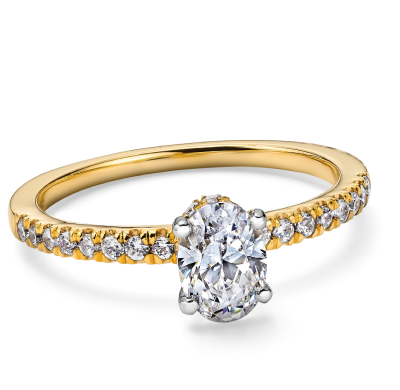 Yellow gold oval-cut diamond engagement ring with diamonds on band.