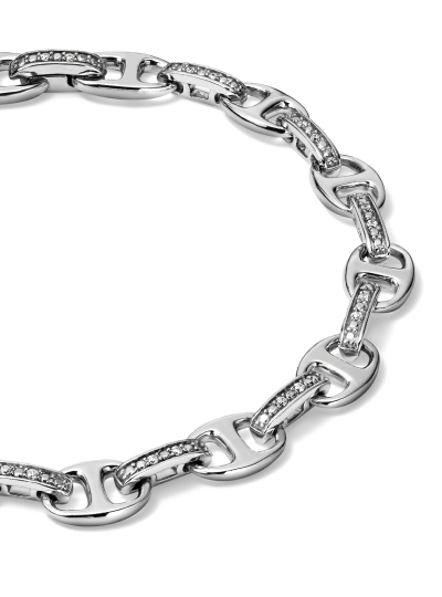 White gold link bracelet with diamond accents.