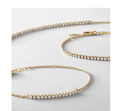Yellow gold diamond tennis bracelets.