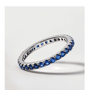 White gold blue sapphire eternity band.