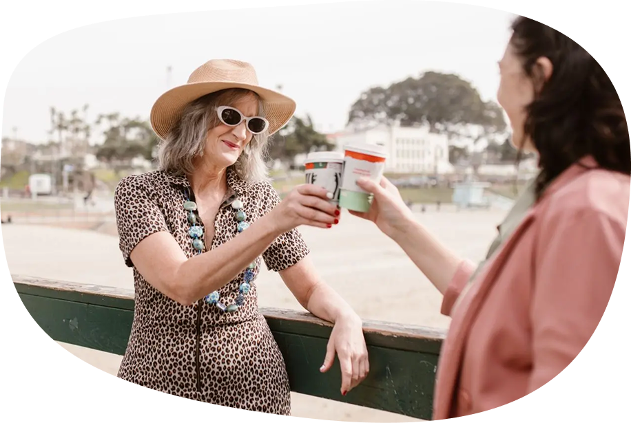 Women holding up coffee cups